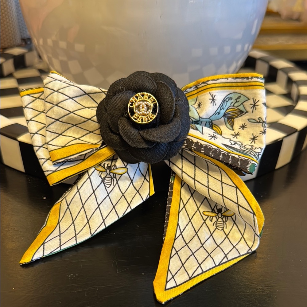 Authentic Chanel button made into a Black and Yellow Bow pin